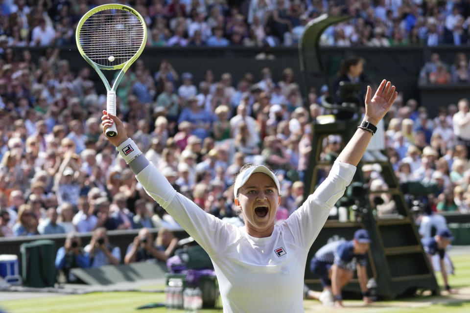 Barbora Krejcikova of the Czech Republic celebrates after defeating Jasmine Paolini of Italy in the women's singles final at the Wimbledon tennis championships in London, Saturday, July 13, 2024. (AP Photo/Kirsty Wigglesworth)