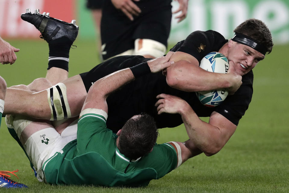 New Zealand's Scott Barrett is taken down by Ireland's Peter O'Mahony during the Rugby World Cup quarterfinal match at Tokyo Stadium between New Zealand and Ireland in Tokyo, Japan, Saturday, Oct. 19, 2019. (AP Photo/Jae Hong)