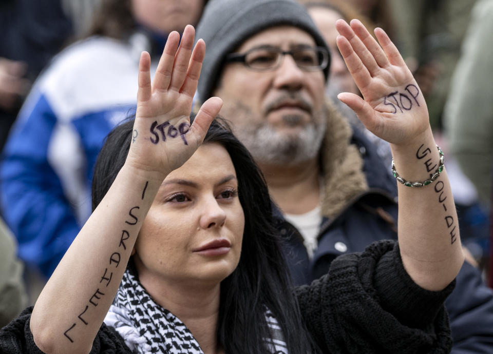 A participant holds up her hands with letterings reading 'Stop Israhell, stop genocide' during a demonstration outside the City Hall in Malmö, Sweden on April 10, 2024 in connection with the municipal board's consideration of a citizens' proposal to stop Israel's participation in the Eurovision Song Contest. The demo was organised by the citizens' initiative 'No Eurovision in Malmö with Israel's participation'. (Photo by Johan NILSSON / TT News Agency / AFP) / Sweden OUT (Photo by JOHAN NILSSON/TT News Agency/AFP via Getty Images)