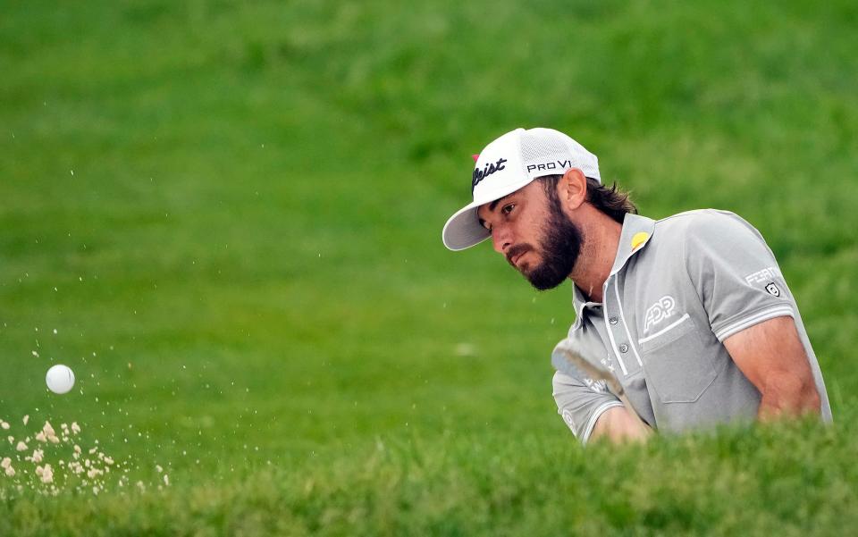 Jun 2, 2022; Dublin, Ohio, USA; Max Homa hits out of the bunker for his third shot on the 10th hole during Round 1 of the Memorial Tournament at Muirfield Village Golf Club in Dublin, Ohio on June 2, 2022. 