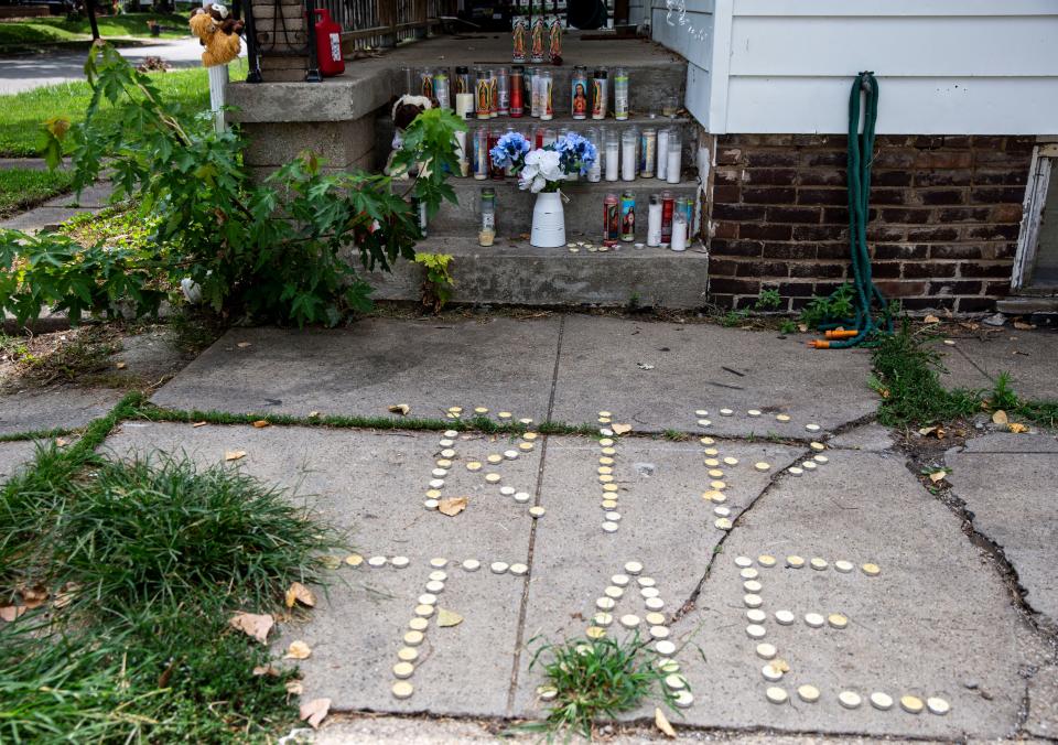 A memorial of candles and stuffed animals has been setup on the steps of the home where Savante English, Keyera Gant and Bryant K. Williams were killed in the 2500 block of South 10th Street in Springfield, Ill., Monday, August 23, 2021. [Justin L. Fowler/The State Journal-Register] 
