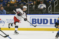 Columbus Blue Jackets' Zach Werenski (8) passes the puck during the first period of an NHL hockey game against the St. Louis Blues on Saturday, Nov. 27, 2021, in St. Louis. (AP Photo/Michael Thomas)