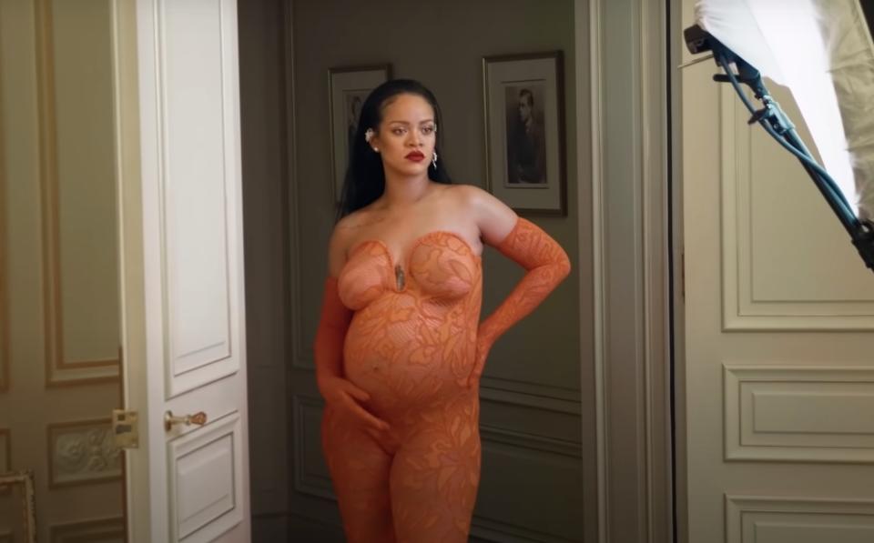 Rihanna wears the actual outfit from the photo shoot in a behind the scenes photo