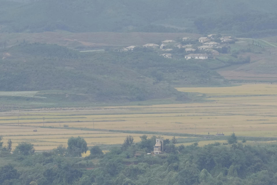 North Korea's Kaepoong town is seen behind a North Korean military guard post, bottom, from the unification observatory in Paju, South Korea, Tuesday, Sept. 28, 2021. North Korea fired a short-range missile into the sea early Tuesday, its neighboring countries said, in the latest weapon tests by North Korea that has raised questions about the sincerity of its recent offer for talks with South Korea. (AP Photo/Lee Jin-man)