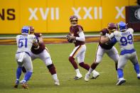 Washington Football Team's Alex Smith drops back to pass during the first half of an NFL football game against the Los Angeles Rams Sunday, Oct. 11, 2020, in Landover, Md. (AP Photo/Susan Walsh)