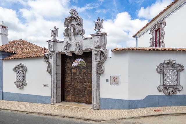 <p>iStock/Getty Images</p> The entrance to the Vermelho hotel, in Melides.