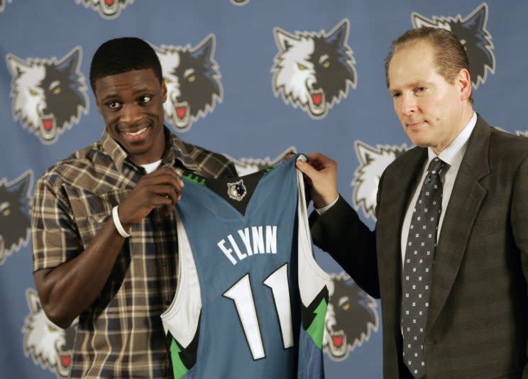 David Kahn poses with Wolves bust Johnny Flynn. (AP)