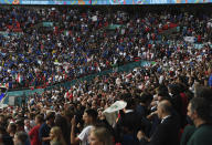 Fans cheer prior to the Euro 2020 final soccer match between Italy and England at Wembley stadium in London, Sunday, July 11, 2021. (Facundo Arrizabalaga/Pool via AP)