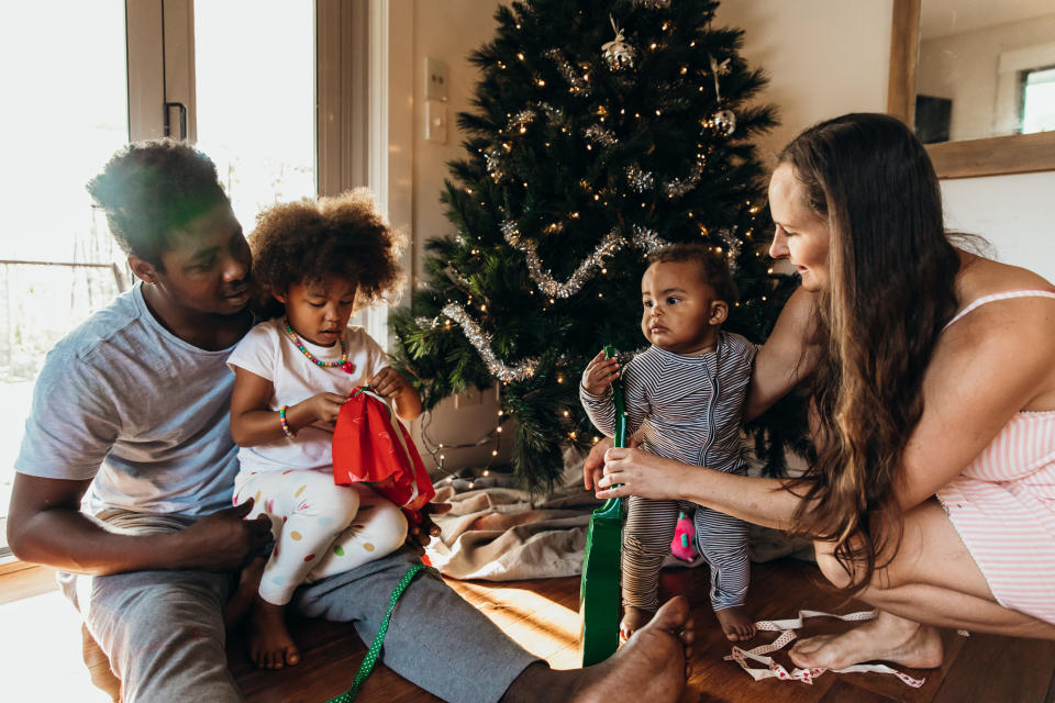 Enjoy the looks on their young faces as they take more than just candy out of their stockings this year. (Photo: LOUISE BEAUMONT via Getty Images)