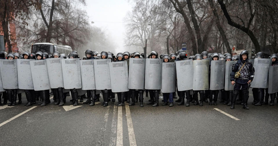 Riot police officers patrol in a street during rally over a hike in energy prices in Almaty, Kazakhstan, Jan. 5, 2022.<span class="copyright">STR/EPA-EFE/Shutterstock</span>