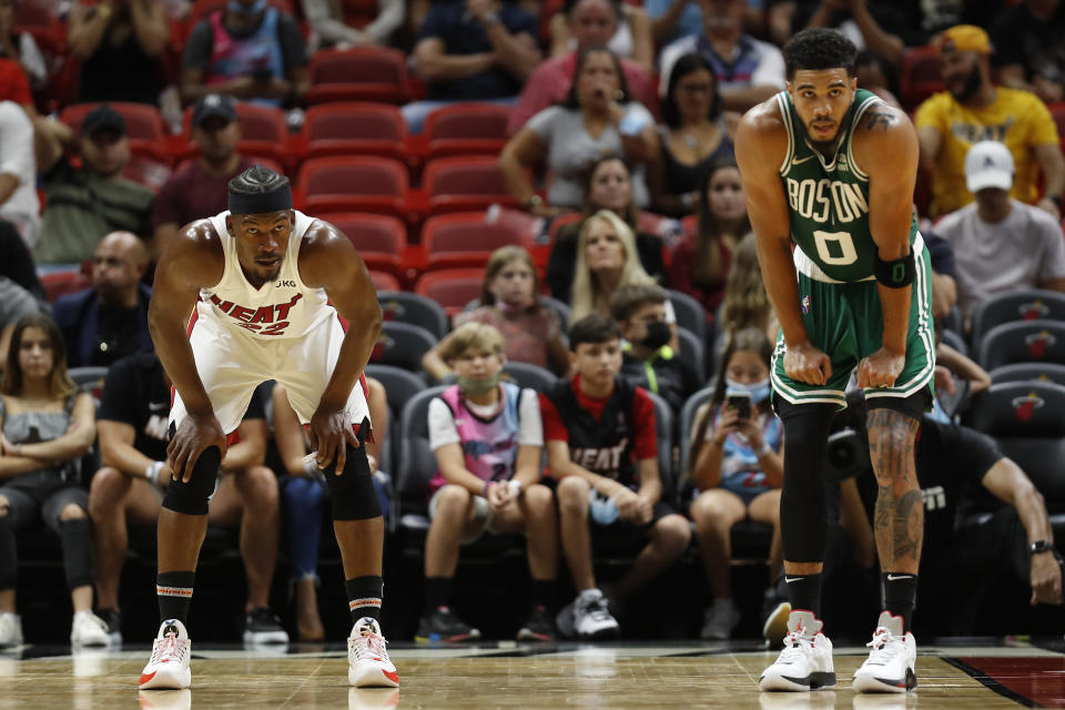 Miami Heat wing Jimmy Butler and Boston Celtics counterpart Jayson Tatum will do battle in the Eastern Conference finals for the second time in three seasons. (Michael Reaves/Getty Images)