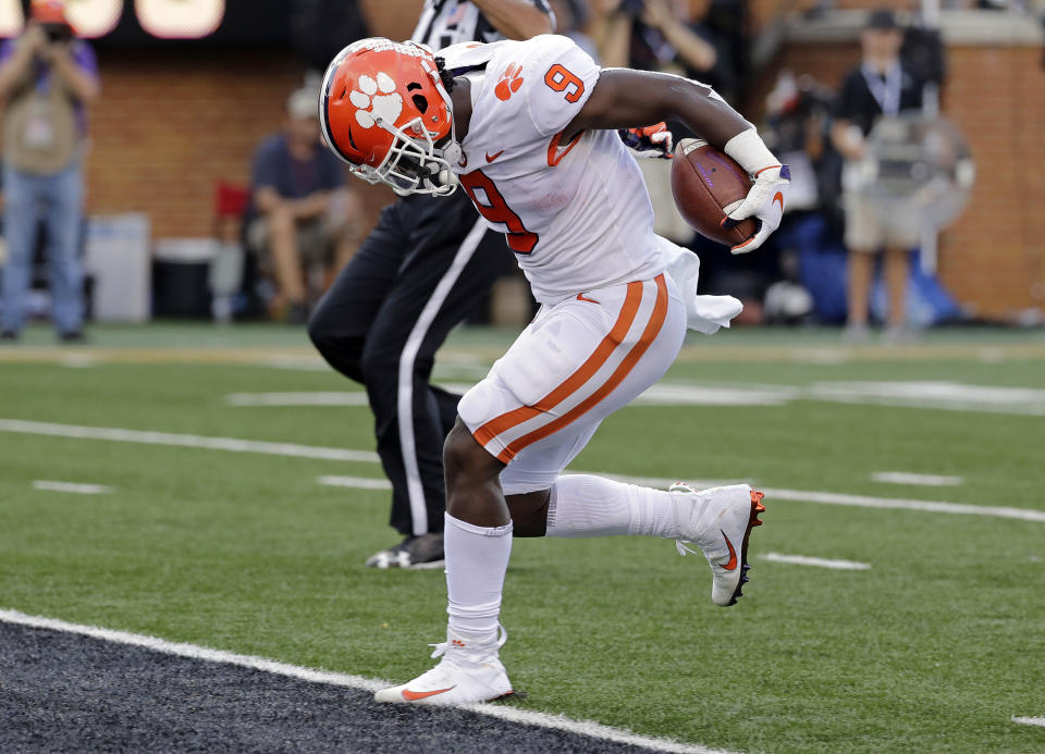 Clemson's Travis Etienne (9) runs for a touchdown against Wake Forest during the first half of an NCAA college football game in Charlotte, N.C., Saturday, Oct. 6, 2018. (AP Photo/Chuck Burton)