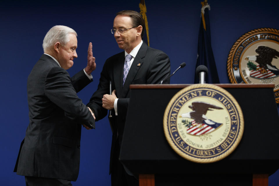 Attorney General Jeff Sessions and Deputy Attorney General Rod Rosenstein shake hands during a news conference at the U.S. Attorney's Office for the District of Columbia in Washington, Monday, Oct. 15, 2018, to announce on efforts to reduce transnational crime. (AP Photo/Carolyn Kaster)