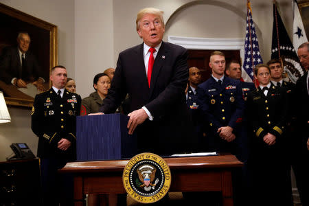 U.S. President Donald Trump participates in a signing ceremony for the National Defense Authorization Act for Fiscal Year 2018 at the White House in Washington D.C., U.S. December 12, 2017. REUTERS/Carlos Barria
