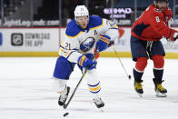 FILE - In this Feb. 18, 2021, file photo, Buffalo Sabres right wing Kyle Okposo (21) skates with the puck during the first period of an NHL hockey game against the Washington Capitals in Washington. (AP Photo/Nick Wass, File)