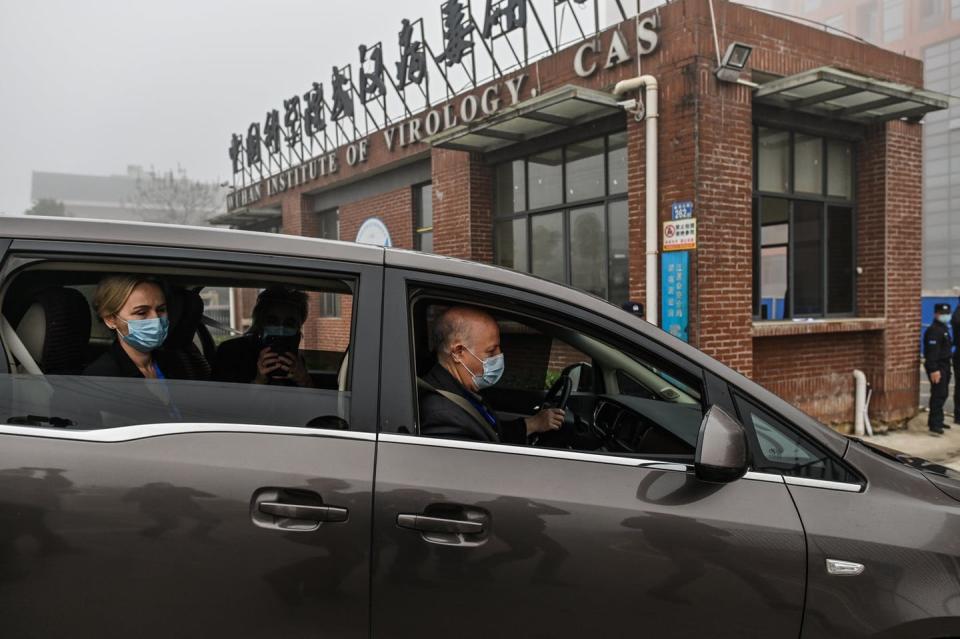 <span class="caption">In February 2021, a World Health Organization team investigating the origins of COVID-19 visited the Wuhan Institute of Virology in Wuhan, China.</span> <span class="attribution"><a class="link " href="https://www.gettyimages.com/detail/news-photo/peter-daszak-thea-fischer-and-other-members-of-the-world-news-photo/1230937740" rel="nofollow noopener" target="_blank" data-ylk="slk:Hector Retamal/AFP via Getty Images;elm:context_link;itc:0;sec:content-canvas">Hector Retamal/AFP via Getty Images</a></span>