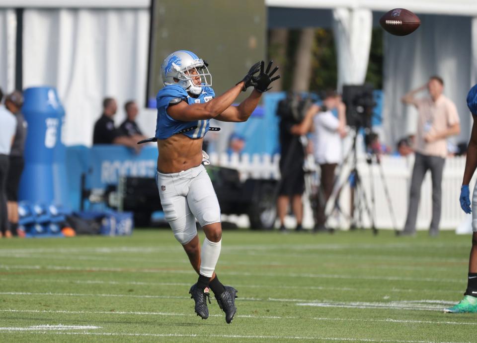 Lions receiver Kalif Raymond goes through passing drills during preseason camp's first practice with pads Aug. 1, 2022 in Allen Park.