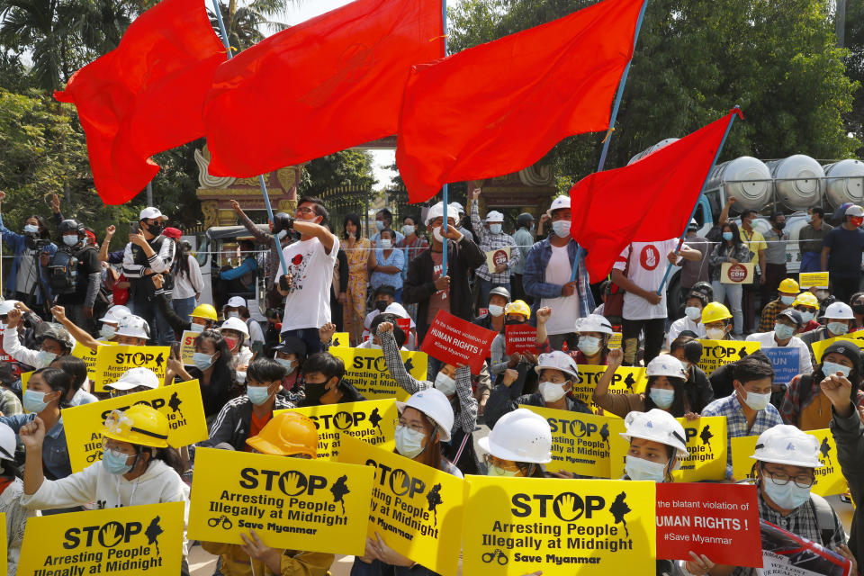 Mandalay University graduates hold posters that say "Stop arresting people illegally at midnight" "Save Myanmar" during an anti-coup protest in Mandalay, Myanmar, Sunday, Feb. 14, 2021. Daily mass street demonstrations in Myanmar are on their second week, with neither protesters nor the military government they seek to unseat showing any signs of backing down from confrontations. (AP Photo)