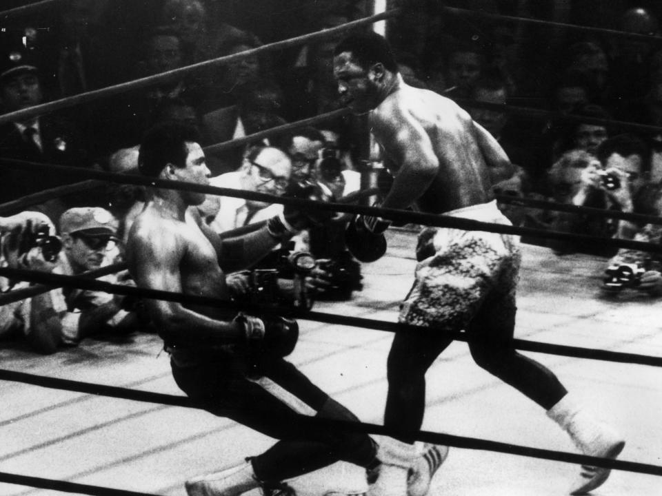 Joe Frazier knocks down Muhammad Ali in their meeting in March 1971 (Getty Images)