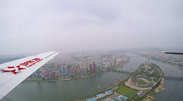 The images show colourful high rise buildings, stadia and looping modern highways. Photo: Aram Pan/DPRK 360