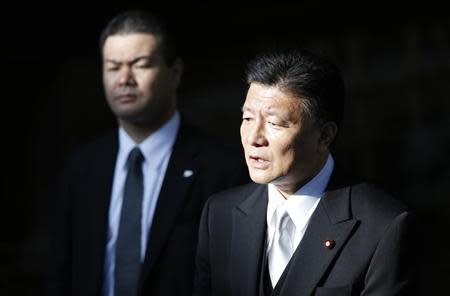 Japan's Internal Affairs and Communications Minister Yoshitaka Shindo speaks to the media after visiting Yasukuni Shrine in Tokyo April 22, 2014. REUTERS/Yuya Shino