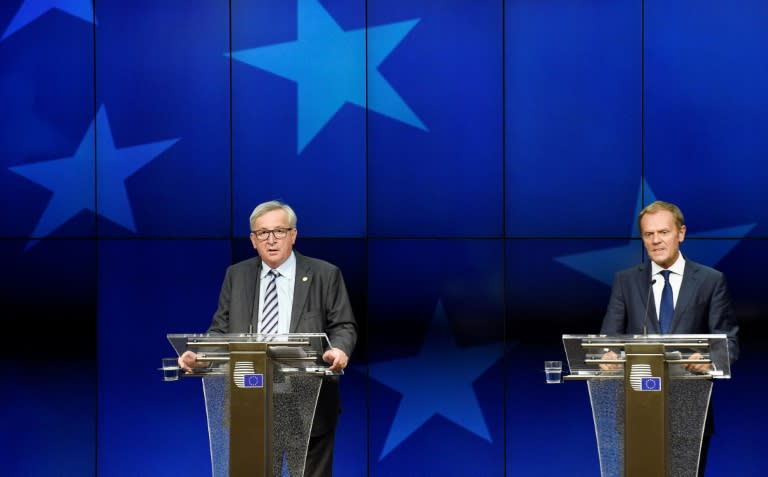 EU Commission President Jean-Claude Juncker (L) gives a press conference with EU Council President Donald Tusk (R) at the EU headquarters in Brussels on June 29, 2016