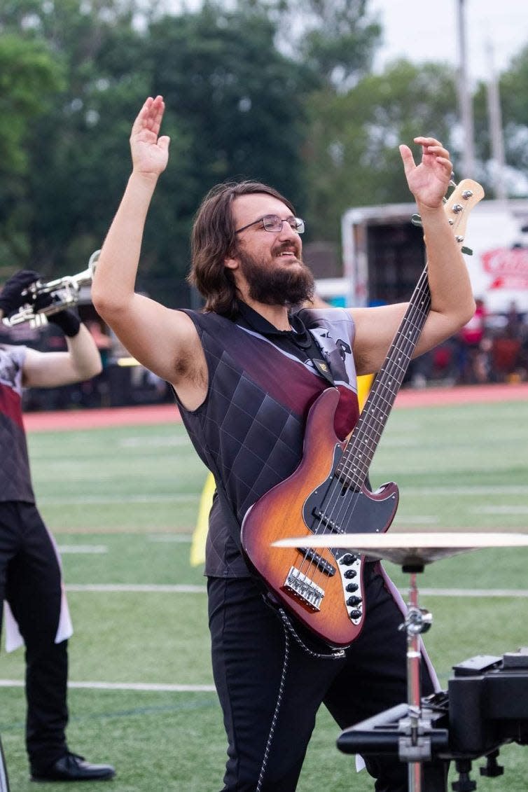 Wil Myers plays his bass guitar with the Rogues Hollow Regiment at Clifton, New Jersey, during a competition in early July. The Drum Corps International (DCI) Drum and Bugle Corps will hold a competition at Orrville football stadium on Friday ,Aug. 4. Six corps, including two locals, will compete. The show combines elements of a Broadway musical and a marching band performance.