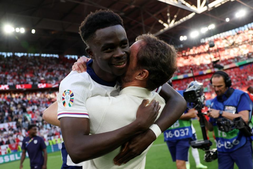 England coach Gareth Southgate shows his affection for Saka (The FA via Getty Images)