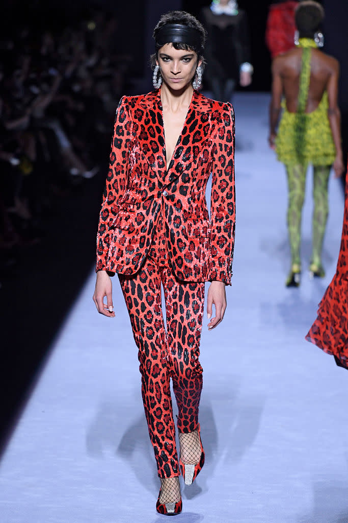 <p>Model wears a red leopard pantsuit at the fall 2018 Tom Ford show. (Photo: Getty Images) </p>