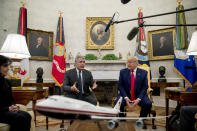 Colombian President Ivan Duque, left, accompanied by President Donald Trump, speaks in the Oval Office of the White House, Monday, March 2, 2020, in Washington. (AP Photo/Andrew Harnik)