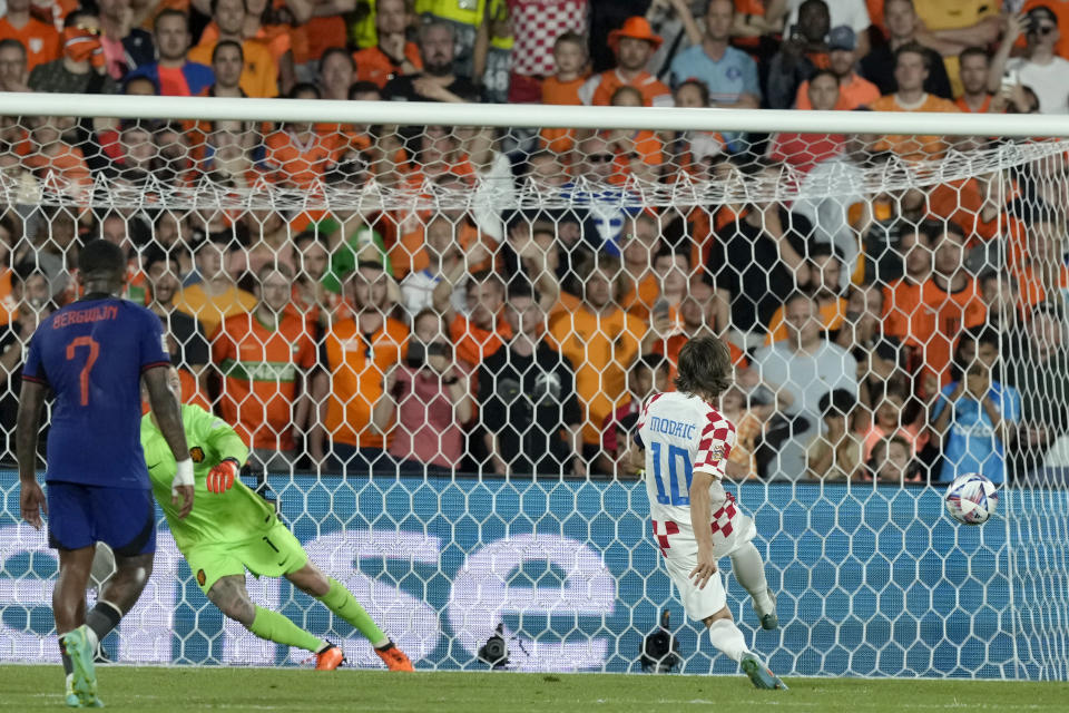 Croatia's Luka Modric scores his side's fourth goal from the penalty spot during the Nations League semifinal soccer match between the Netherlands and Croatia at De Kuip stadium in Rotterdam, Netherlands, Wednesday, June 14, 2023. (AP Photo/Peter Dejong)