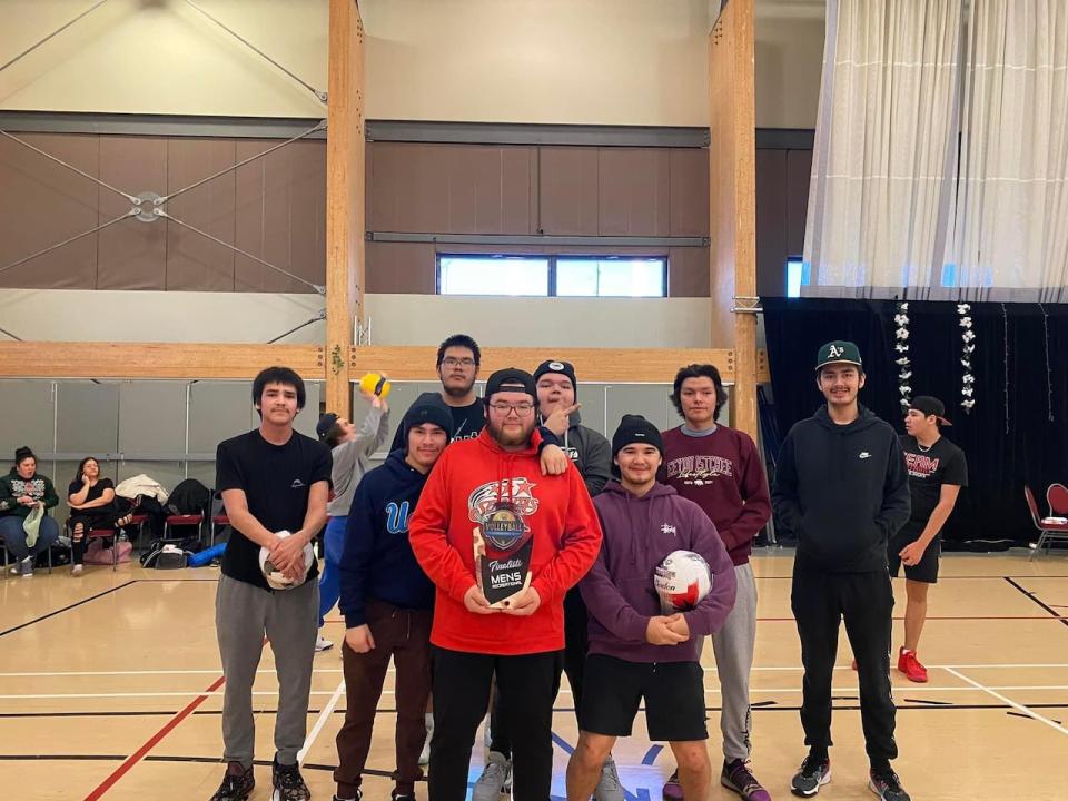 Reshawn Matoush, front centre, holds finalists trophy, where he played in the same tournament as his grandpa. He hopes to keep playing as long as he can, just like his grandpa. 