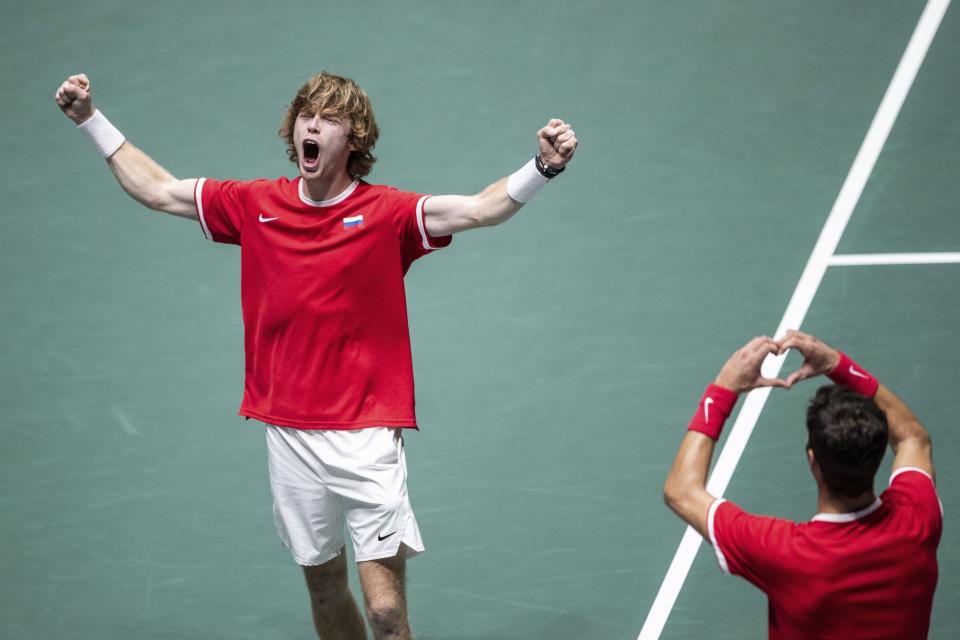 Russia's Karen Khachanov, right, and Andrey Rublev celebrate after winning the Davis Cup quarterfinal doubles match against Serbia's Novak Djokovic and Viktor Troicki in Madrid, Spain, Friday, Nov. 22, 2019. (AP Photo/Bernat Armangue)