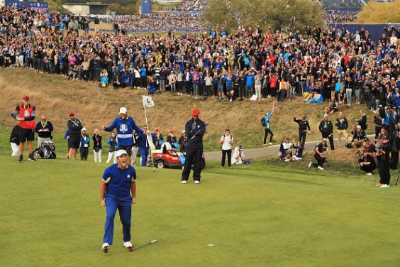 Rahm celebrates after defeating Woods in the singles in Paris (Getty)