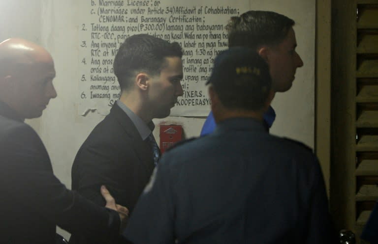US Marine Joseph Scott Pemberton (centre) was sentenced to a minimum of six years in jail for the death of a transgender Filipina