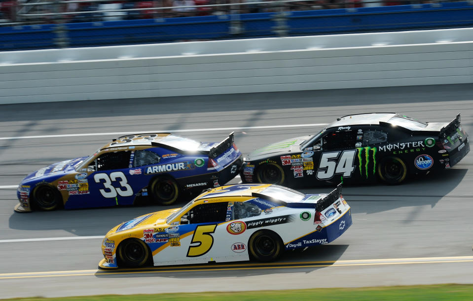 TALLADEGA, AL - MAY 05: Dale Earnhardt Jr., driver of the #5 Hellmann's Chevrolet, Kevin Harvick, driver of the #33 Armour Meats Chevrolet, and Kyle Busch, driver of the #54 Monster Energy Toyota, race during the NASCAR Nationwide Series Aaron's 312 at Talladega Superspeedway on May 5, 2012 in Talladega, Alabama. (Photo by Jared C. Tilton/Getty Images)