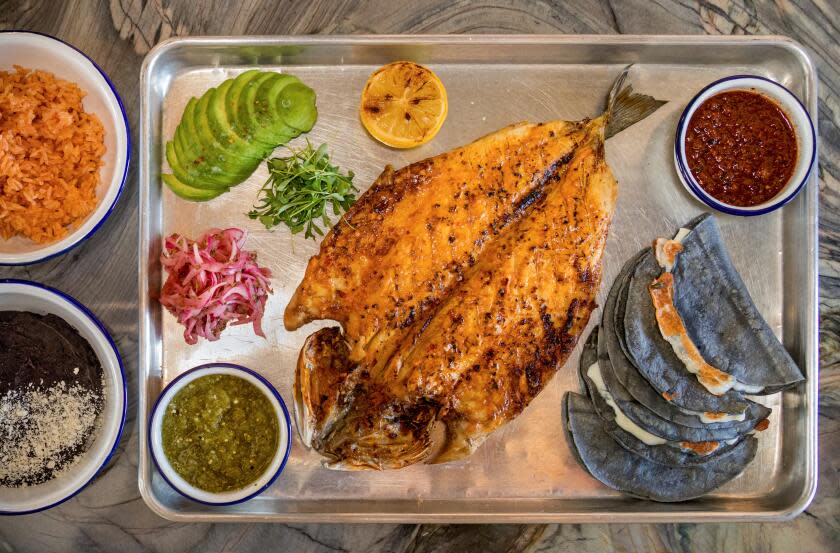 LOS ANGELES, CA - THURSDAY, JULY 7, 2023 - Zarandeados - pesca del dia platter served at Loreto in Frogtown. (Ricardo DeAratanha/Los Angeles Times)