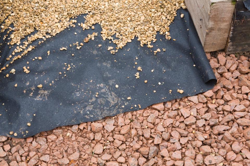 overhead view of landscaping fabric and gravel