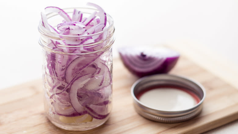 Mason jar of red onions
