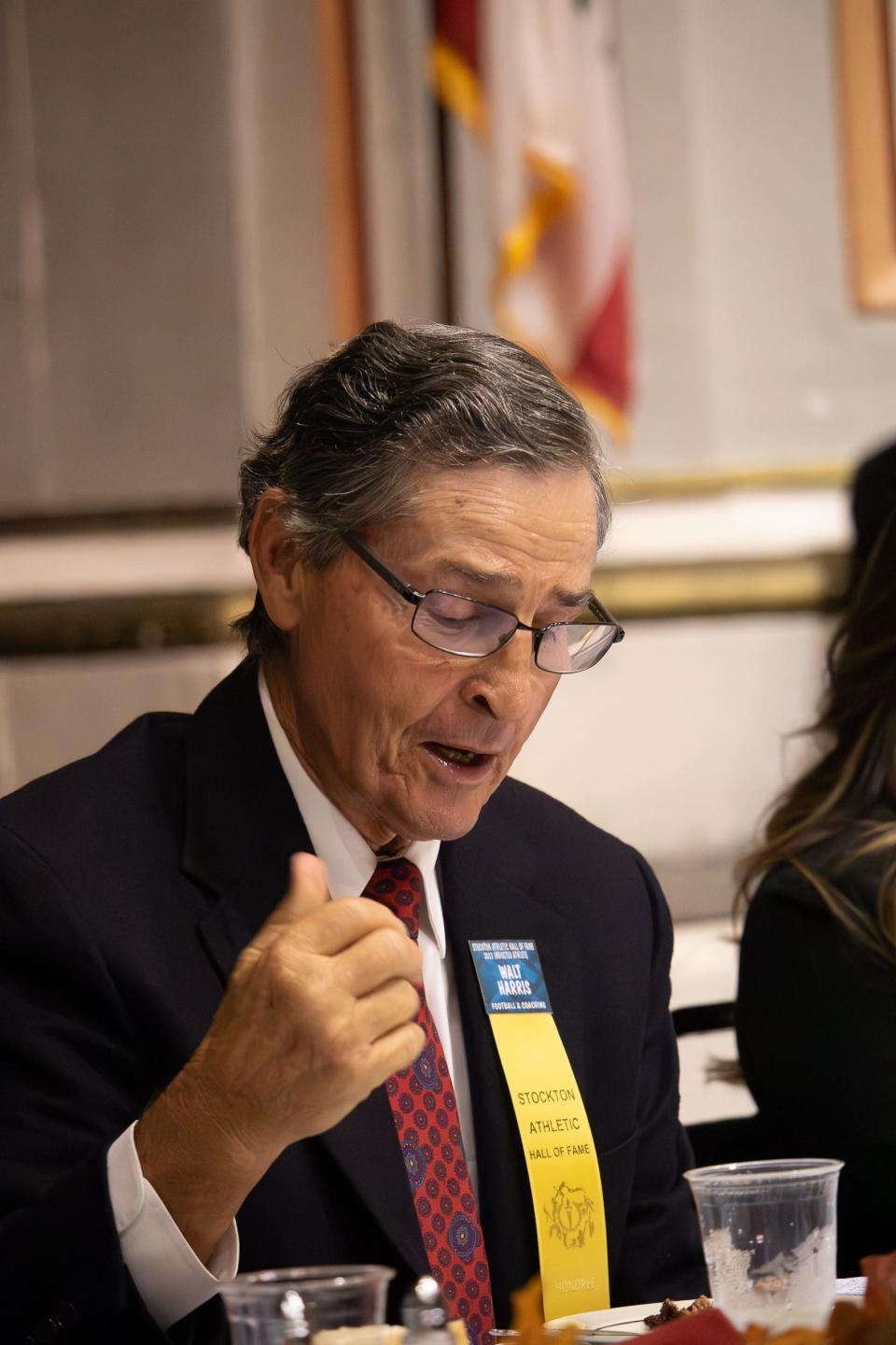 Walt Harris, Stockton Athletic Hall of Fame inductee, engages in conversation with the attendees at the award ceremony in the Stockton Civic Hall Auditorium in Stockton,CA on Nov. 15, 2023.