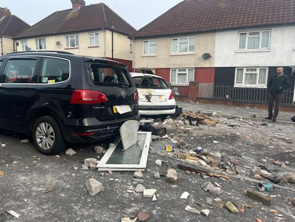 Bricks and concrete strewn all over Snowden Road in Ely, Cardiff, on Tuesday. (Reach)