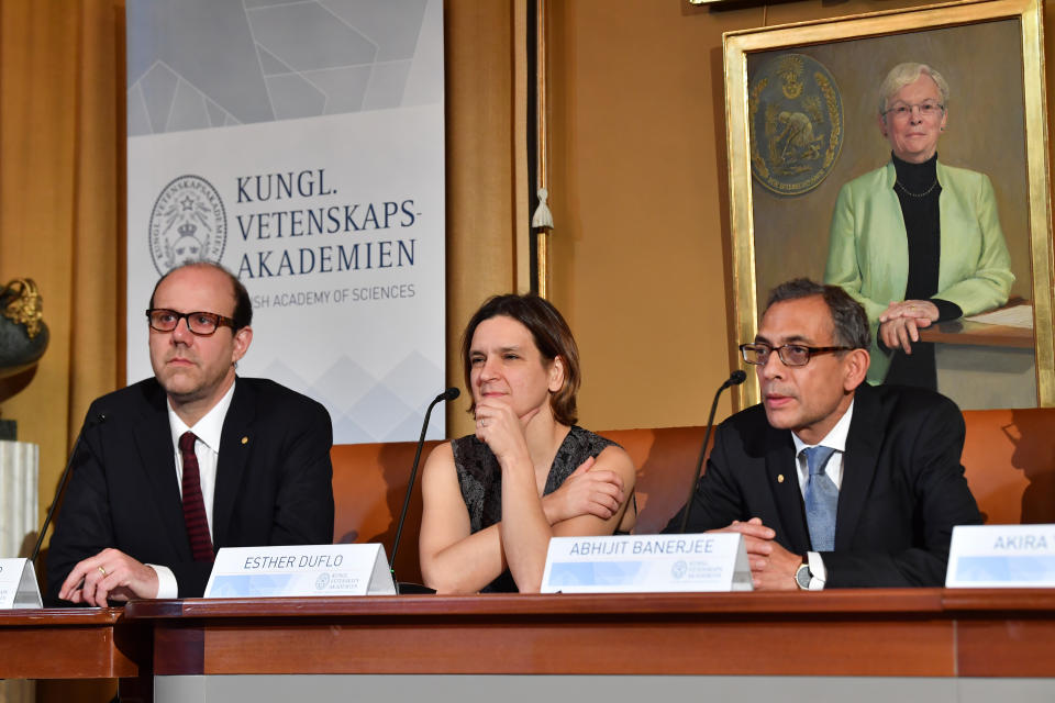 From left, Nobel Laureates in Economic Sciences Michael Kremer, Esther Duflo and Abhijit Banerjee attend a press conference at the Royal Swedish Academy of Sciences in Stockholm, Sweden Saturday, Dec. 7, 2019. (Jonas Ekstromer /TT News Agency via AP)