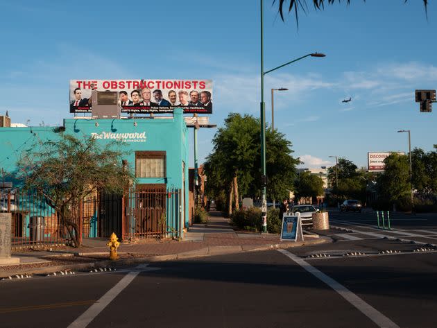 A billboard depicting radical conservative members of Congress as “The Obstructionists” towers over a street in Phoenix. (Photo: Molly Peters for HuffPost)