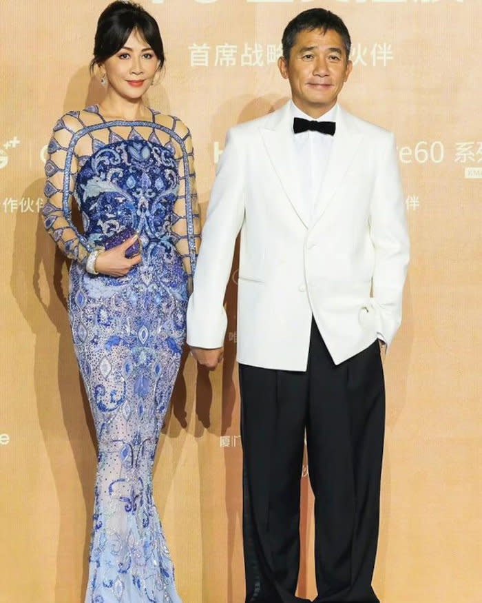 Tony attending with wife Carina Lau