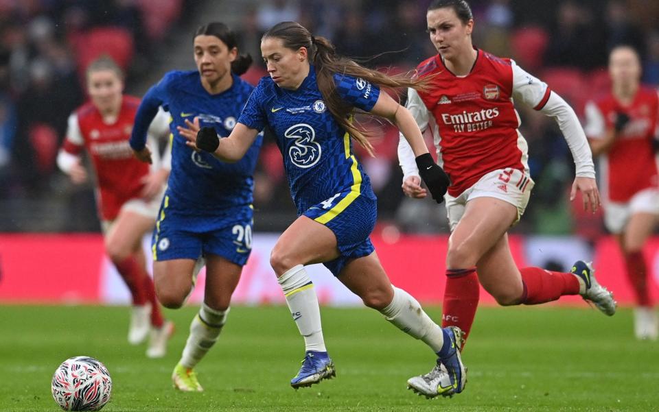 Chelsea's English striker Fran Kirby (C) runs away from Arsenal's English defender Lotte Wubben-Moy (R) during the English Women's FA Cup final football match between Arsenal and Chelsea at Wembley Stadium in London on December 5, 2021 - AFP