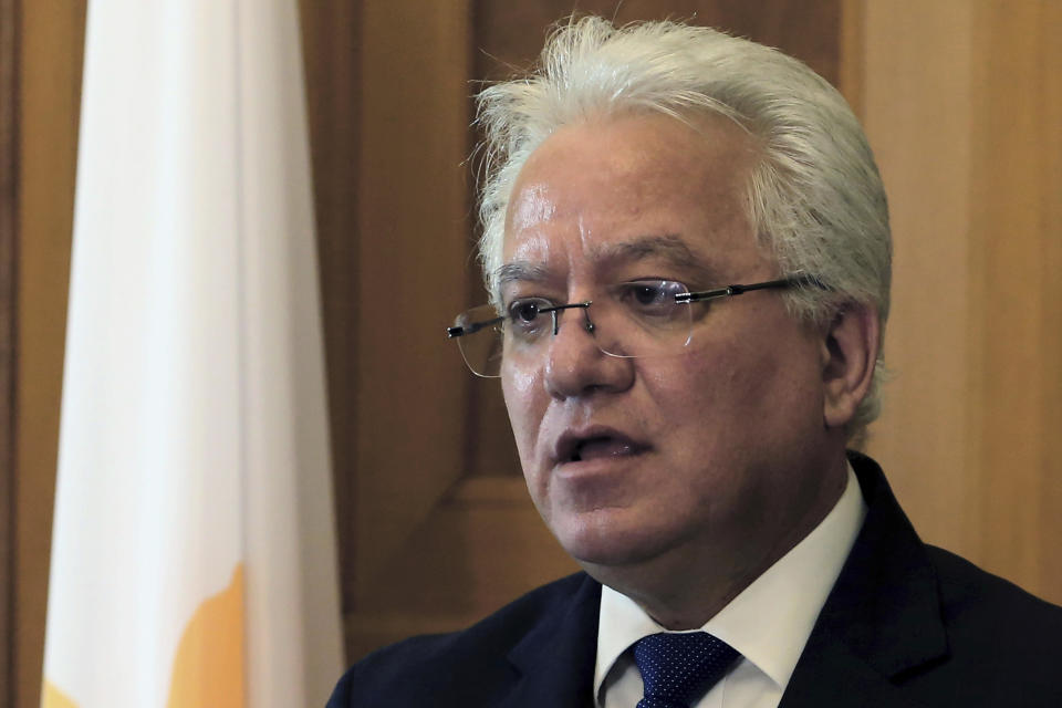 Cyprus' Justice Minister Ioanas Nicolaou talks to the media after a meeting with Cyprus' president Nicos Anastasiades at the presidential palace in capital Nicosia, Cyprus, Thursday, May 2, 2019. Nicolaou has resigned over the case of a serial killer who has confessed to killing seven foreign women and girls amid mounting reports that police had bungled their investigation when some of the victims were initially reported missing. (AP Photo/Philippos Christou)