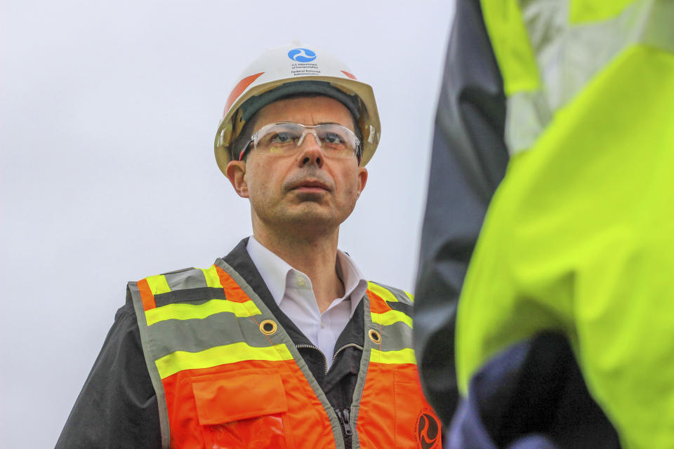 Transportation Secretary Pete Buttigieg tours the site of the Norfolk Southern train derailment on Feb. 23, 2023 in East Palestine, Ohio. (Allie Vugrincic/The Vindicator via AP, Pool)