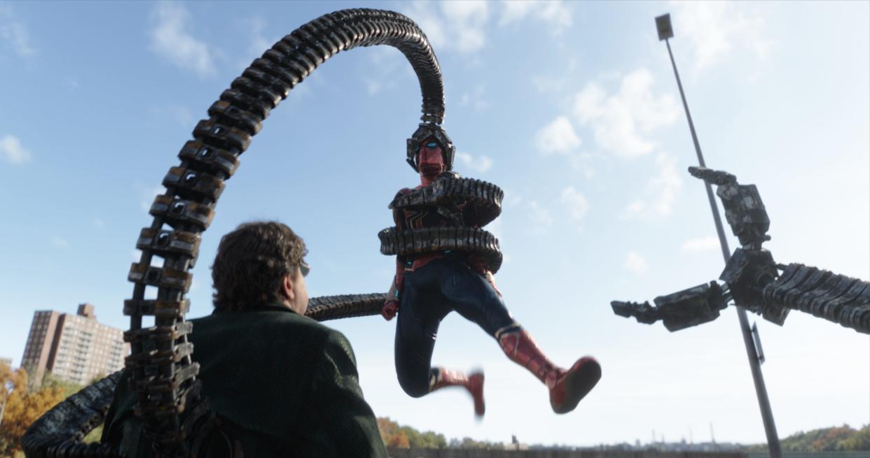 A returning Doc Ock (Alfred Molina, left) and Spider-Man (Tom Holland) duke it it out in "Spider-Man: No Way Home."