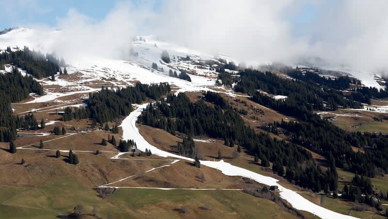 A strip of snow makes a ski slope in Saalbach, Austria, Sunday, March 17, 2024. In March 2024, Earth set another monthly record for global heat — for the 10th consecutive month.
