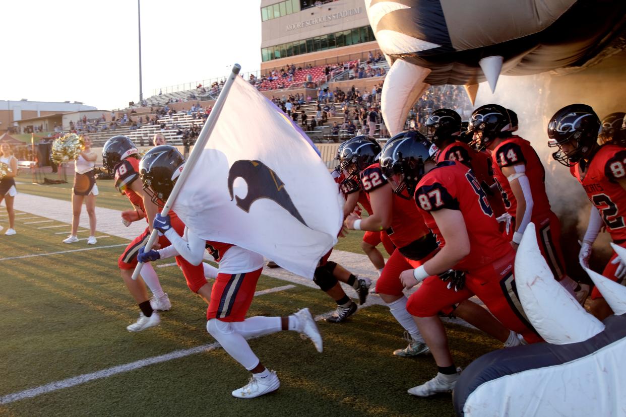 Southmoore takes the field before a high school football game between Southmoore and Bixby in Moore, Okla., Thursday, Sept. 28, 2023.